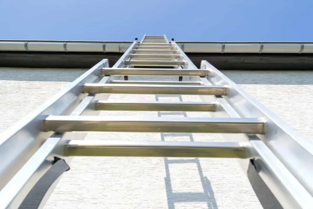 How to Tarp a Roof After Storm Damage climbing ladder