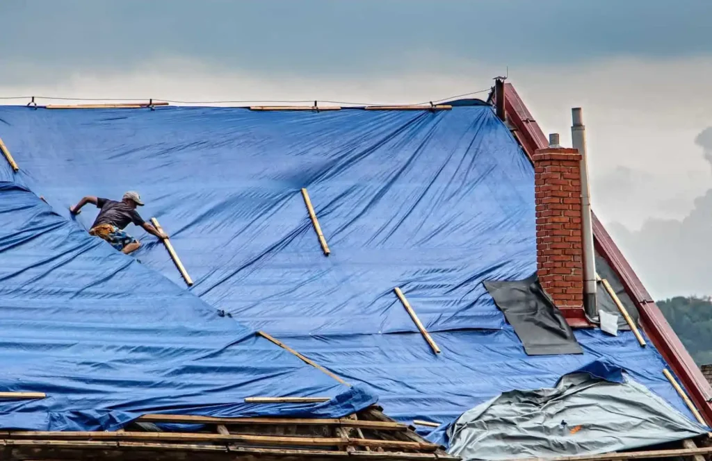 How to Tarp a Roof After Storm Damage professional roofer