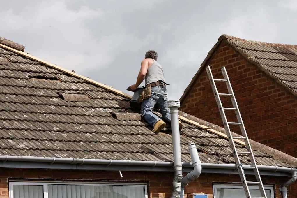 Workman repairing the roof